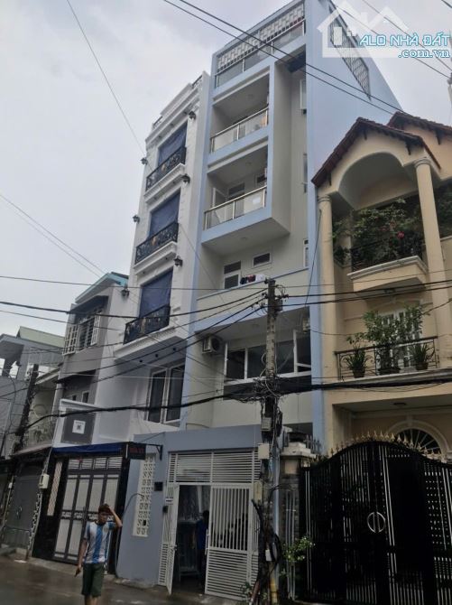 Toà Nhà 7 tầng đường Phổ Quang (5mx24m. Nở hậu 6,5m). Giá 29 tỷ