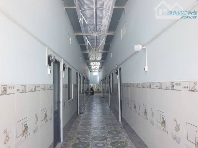 Bán dãy trọ 15 phòng ngay KCN Tây Bắc, 383m2 sổ hồng riêng, Gía 1 Tỷ