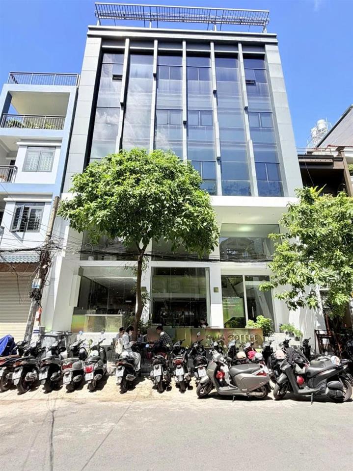 Bán Nhà 7 Tâng - Mặt tiền Hẻm 12m Nguyễn Gia Trí, 12x20m, Dòng tiền 300 triệu, 89,9 Tỷ.