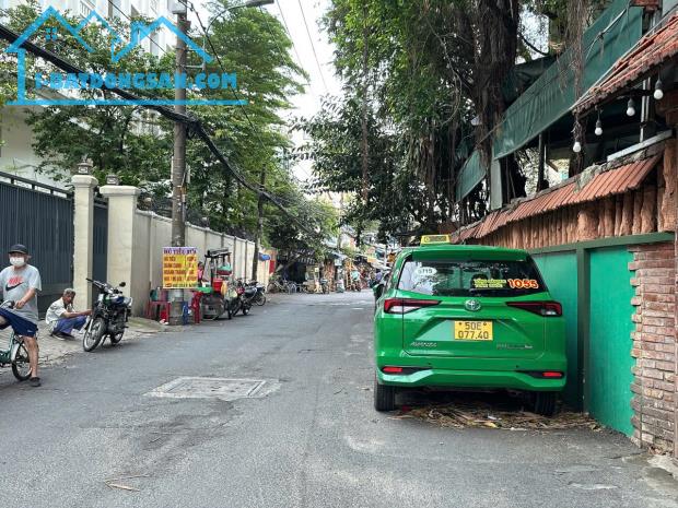 Bán nhà 7 tầng đẹp hẻm 656 Quang Trung ngang 6m có hầm T.máy ở ngay gần chợ 24 tỷ.